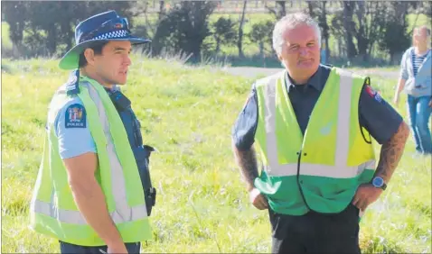  ??  ?? James talks with Senior Sergeant Jymahl Glassey at the train crash exercise in March.