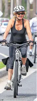  ??  ?? Meanwhile: Kate's mother Goldie Hawn was keeping fit during a bike ride in Los Angeles, with longtime man Kurt Russell in tow