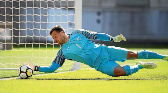  ?? ANDREW CORNAGA/PHOTOSPORT ?? New Zealand goalkeeper Stefan Marinovic makes a crucial, desperate save on the line. ‘‘’’I had to do what I had to do,’’ he said.