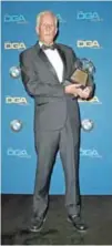  ??  ?? Director Michael Apted, recipient of the DGA Honorary Life Member Award, poses in the press room during the 70th Annual Directors Guild Of America Awards.