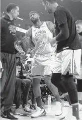  ?? EZRA SHAW/GETTY ?? DeMarcus Cousins hobbles to the locker room after tearing his left quad during the Warriors’ loss Monday.