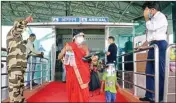  ??  ?? A migrant woman checks out from the Birsa Munda Internatio­nal Airport along with her children after their arrival by a special flight from Mumbai, during ongoing lockdown, in Ranchi, on Thursday