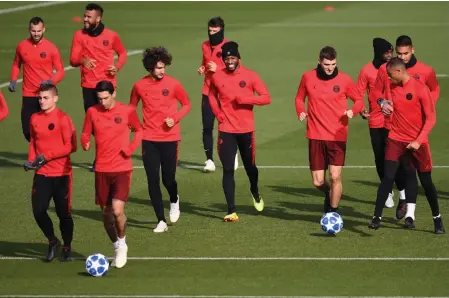  ?? AFP ?? Paris Saint- Germains players run during a training session at the Camp des Loges in Saint- Germain- en- Laye on the outskirts of Paris, on Tuesday, the eve of their Champions League match against SSC Napoli. —