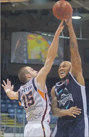  ?? JASON MALLOY/THE GUARDIAN ?? Island Storm forward Al Richter contests Halifax Hurricanes forward Tyrone Watson’s shot Thursday during Game 3 of the teams’ best-of-seven National Basketball League of Canada semifinal at the Eastlink Centre.