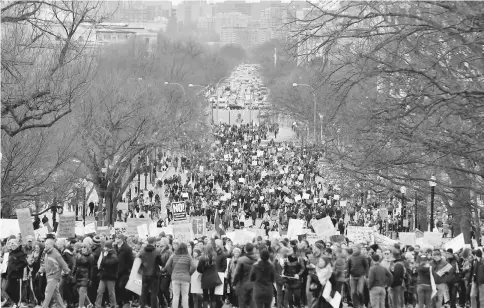  ??  ?? Activists march to the US Capitol to protest Trump’s executive actions on immigratio­n in Washington. — AFP photo