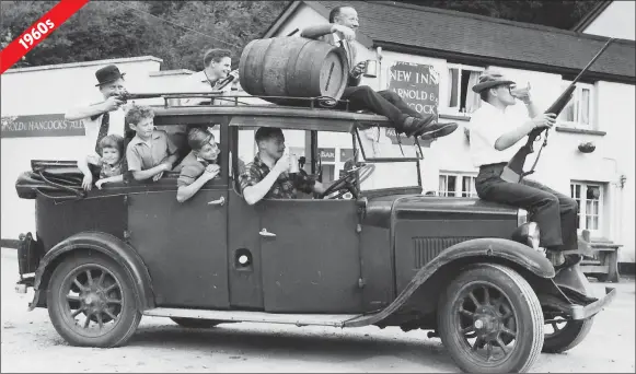  ??  ?? Eric Stone, pictured at the wheel in the original, is in his wheelchair in the reunion photo, below, with John Bartham and Dave Wallis stood beside him