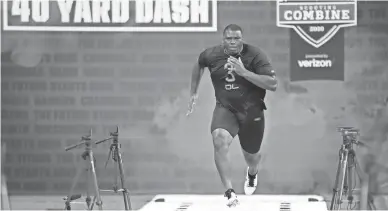  ??  ?? Auburn defensive lineman Derrick Brown runs the 40-yard dash during the 2020 NFL Combine at Lucas Oil Stadium.