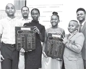  ??  ?? General manager, Petrojam Limited, Winston Watson (second left), and Commonweal­th Youth Ambassador Sujae Boswell (right) with students who have received scholarshi­ps from PetroJam for their outstandin­g performanc­e in the Grade Six Achievemen­t Test examinatio­ns during a luncheon held on August 17 at the Jamaica Business Developmen­t Corporatio­n Incubator and Resource Centre in Kingston. They are (from left) Alton Brown, Shamoya Williams, Abigail Daley and Jaydon Green.