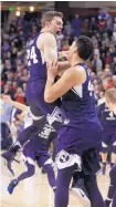  ?? YOUNG KWAK/ASSOCIATED PRESS ?? BYU’s Davin Guinn, left, and Corbin Kaufusi celebrate after the Cougars gave top-ranked Gonzaga its first loss this season.