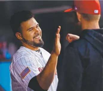  ??  ?? Antonio Senzatela is congratula­ted in the Rockies dugout Tuesday.