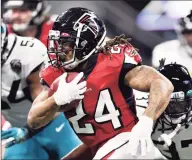  ?? Danny Karnik / Associated Press ?? Devonta Freeman, seen here playing for the Falcons in December, signed with the Giants Tuesday, and the veteran running back could practice with the team as early as Wednesday, according to sources.