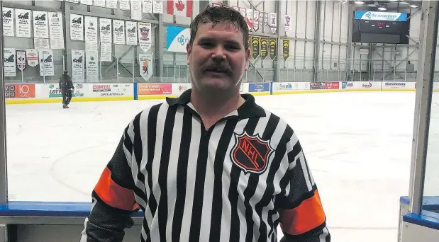  ?? — REGINA LEADER-POST ?? Luke McGeough is shown wearing the NHL jersey of his late father, NHL ex-referee Mick McGeough, in Regina on Wednesday.