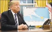  ?? Win McNamee Getty Images ?? PRESIDENT TRUMP at an Oval Office briefing this week on preparatio­ns for Hurricane Florence.