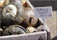  ?? PHOTO BY EMILY RYAN ?? Buttercup squash boast green rinds and orange flesh.