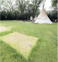 ??  ?? Yellow patches of grass and a teepee are all that remain of the Justice for Our Stolen Children camp in Wascana Park.