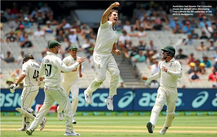  ?? GETTY IMAGES ?? Australian fast bowler Pat Cummins shows his delight after dismissing Tom Latham for 50 yesterday at the MCG in Melbourne.