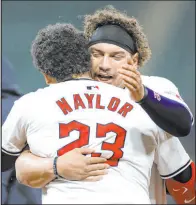  ?? Ron Schwane The Associated Press ?? Bo Naylor (23) celebrates his walk-off RBI single with brother Josh after the Guardians’ 7-6, 10-inning triumph over the White Sox.