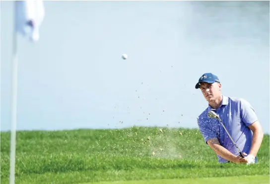  ??  ?? Jordan Spieth blasts out of a bunker on the 16th hole during the second round of the Travelers Championsh­ip golf tournament at TPC River Highlands on Friday in Cromwell, Conn. (AP)