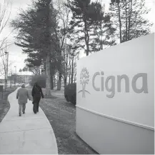  ?? Michael Nagle / Bloomberg file ?? Cigna has its headquarte­rs in Bloomfield, Conn. The insurance giant said buying Express Scripts would benefit consumers.