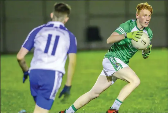  ??  ?? Killian Foley of St Molaise Gaels wins possession as Sam Barnes of St Marys moves in to intercept. Pics: Tom Callanan.