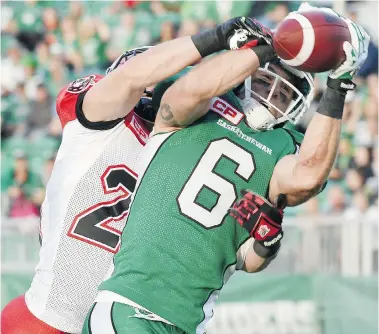  ?? DON HEALY/Leader-Post ?? Saskatchew­an Roughrider­s receiver Rob Bagg makes a catch for a 34-yard gain despite tight coverage from the Calgary
Stampeders’ Adam Berger on Friday night at Mosaic Stadium.