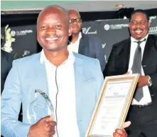  ??  ?? Best Conservati­on Manager Khetha Amos Tembe of Hluhluwe-iMfolozi Park proudly displays his awards