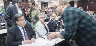 ?? PAUL CHIASSON/THE CANADIAN PRESS ?? Saint John Mayor Don Darling blamed Energy East opponents — such as Montreal Mayor Denis Coderre, seen above left during a hearing on the project in 2016 — for its demise.