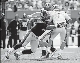  ?? [RON SCHWANE/THE ASSOCIATED PRESS] ?? Cameron Heyward, sacking the Browns’ DeShone Kizer, is on pace to become the Steelers’ first defensive lineman to record 10 sacks or more in a season since 1986.