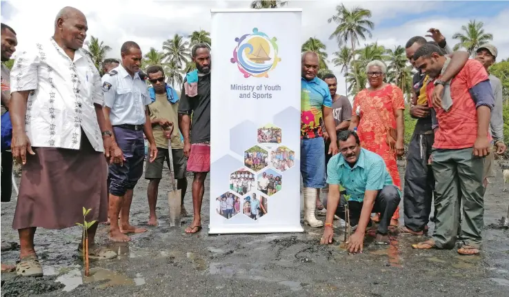  ?? Photo: ?? Minister for Youth and Sports Parveen Bala with Navuniivi villagers during a mangrove planting programme in Ra.