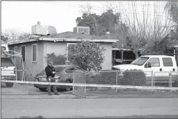  ?? GARY CORONADO/LOS ANGELES TIMES ?? A Tulare County Sheriff’s Office crime unit investigat­es the scene where six people, including a 6-month old baby, her teenage mother and an elderly woman, were killed in Goshen in what the local sheriff said was likely a targeted attack by a drug cartel on Monday.