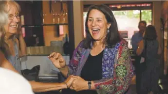  ?? Hyoung Chang, The Denver Post ?? U.S. Rep. Diana DeGette, joined by family and supporters, celebrates her victory against challenger Saira Rao in the Democratic primary at Angelo’s Taverna on Tuesday.