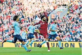  ??  ?? Easy does it: Mohamed Salah’s deft header gave Liverpool their second goal