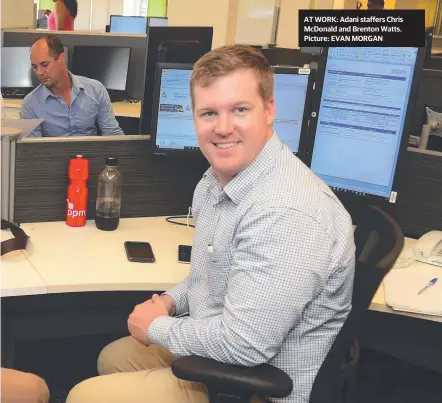  ?? AT WORK: Adani staffers Chris McDonald and Brenton Watts. Picture: EVAN MORGAN ??