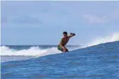  ??  ?? ABOVE: 2018 Teahupoo Champion, Gabriel Mendina, enjoying a free surf during a contest layday.