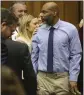  ?? CHRISTIAN GOODEN — ST. LOUIS POST-DISPATCH VIA AP ?? Lamar Johnson, right, looks toward friends and family members as his attorneys celebrate on Tuesday.