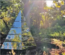  ??  ?? A striking silver pyramid reflects the sunshine in the Castle gardens.