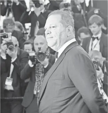  ?? ANNE-CHRISTINE POUJOULAT, AFP/GETTY IMAGES ?? Hollywood is taking a painful look within after stunning allegation­s of a decades-long culture of sexual abuse by movie mogul Harvey Weinstein.
