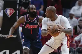  ?? WILFREDO LEE — THE ASSOCIATED PRESS, FILE ?? Heat forward P.J. Tucker, right, looks for an opening past 76ers guard James Harden (1) during the first half of Game 5of a second-round playoff series on May 10in Miami.