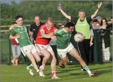  ??  ?? Darragh Gallagher, St Molaise Gaels keeps hold of possession. Pic: Carl Brennan.