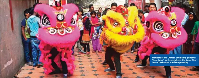  ??  ?? Members of the Chinese community perform a “lion dance” as they celebrate the Lunar New Year of the Rooster in Kolkata yesterday.