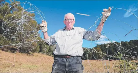  ?? Picture: RICHARD GOSLING ?? Graeme Sleeman says he has spent $15,000 repairing fences cut by trepassing riders and pot growers.