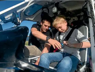  ?? PHOTOS: ALDEN WILLIAMS/STUFF ?? Edward Nye, 12, might have to start saving. He enjoyed Thursday’s helicopter trip so much he wants to be pilot - an ‘‘expensive hobby’’, according to former All Black caption Richie Mccaw.