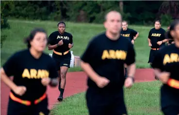  ?? AP ?? Recruits taking part in the new US Army preparator­y course do physical training at Fort Jackson, South Carolina, to help them get into shape before they begin basic training. The high rate of weight disorders among the US population is one reason why the army has been struggling to attract recruits.