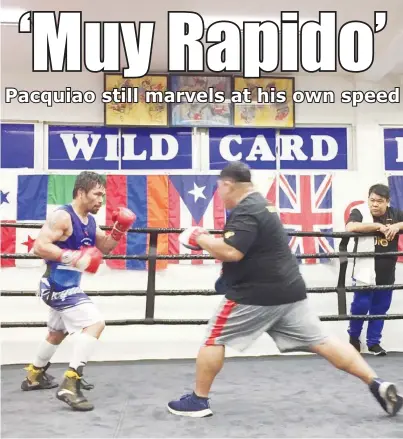  ?? (Nick Giongco) ?? REVVING UP: Manny Pacquiao (left) and chief trainer Buboy Fernandez work on their strategy on Thursday in Los Angeles.