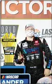  ??  ?? Austin Hill (16) poses at Victory Lane after winning the NASCAR Westgate 200 auto race at Las Vegas Motor Speedway on Sept 25, in
Las Vegas. (AP)