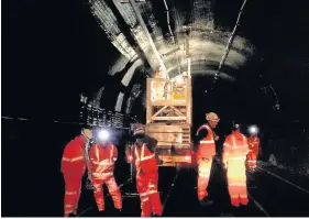  ??  ?? > Work taking place inside the Severn Tunnel to prepare for electrific­ation