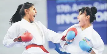  ??  ?? Malaysia’s Syakilla Salni Jefry Krisnan (left) fights against Uzbekistan’s Barno Mirzaeva in the women’s kumite under 61kg final during the 17th Asian Games in Incheon in this October 3, 2014 file photo. Syakilla won the gold medal. Karate, which will be making its debut appearance at the Olympics in 2020 in Tokyo, has emerged as one of the gold medal prospects for Malaysia. — Bernama photo