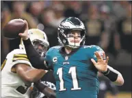  ?? Gerald Herbert / Associated Press ?? Eagles quarterbac­k Carson Wentz passes against the Saints on Nov. 18. The defending champion Eagles (4-6) have lost two in a row, and some misguided fans were even calling for Super Bowl MVP Nick Foles to replace Wentz in the starting lineup following his career-worst effort in a 48-7 loss to New Orleans.
