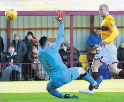  ??  ?? Cool finish Main knocks in Motherwell’s second goal