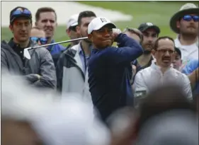  ?? PHOTO/CHRIS CARLSON ?? Tiger Woods hits from the third tee during a practice round for the Masters golf tournament Wednesday in Augusta, Ga. AP